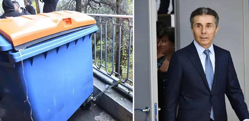 Участники акции прикрепили замком к перилам у дома Бидзины Иванишвили мусорный бак